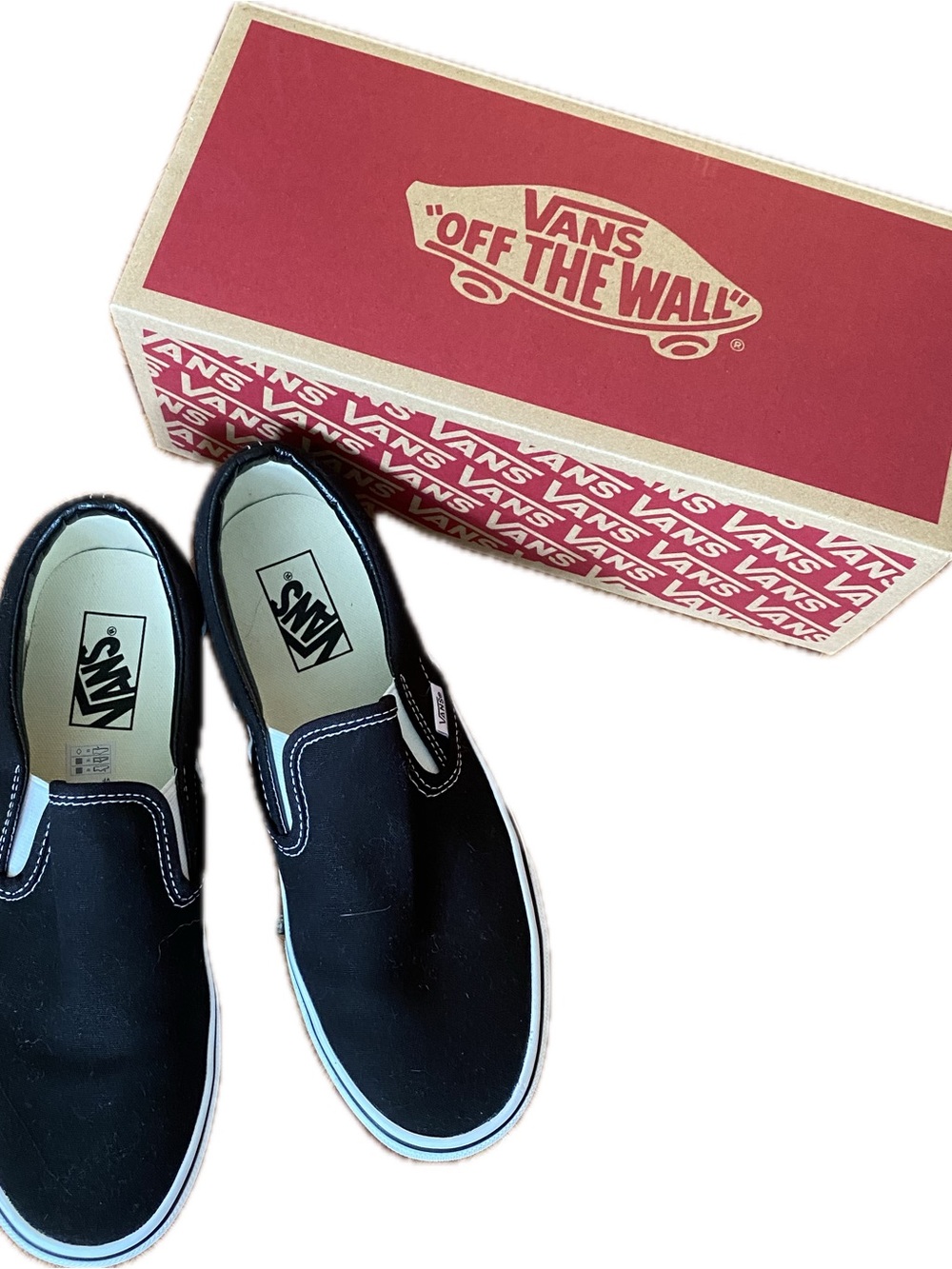Vans Black and White Slip-On Sneakers